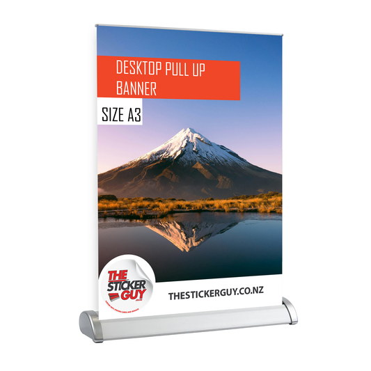 Desktop pull-up banner with mountain landscape design and 'The Sticker Guy' branding.