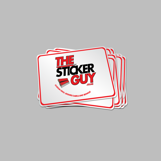 Stack of 'The Sticker Guy' branded stickers on a gray background