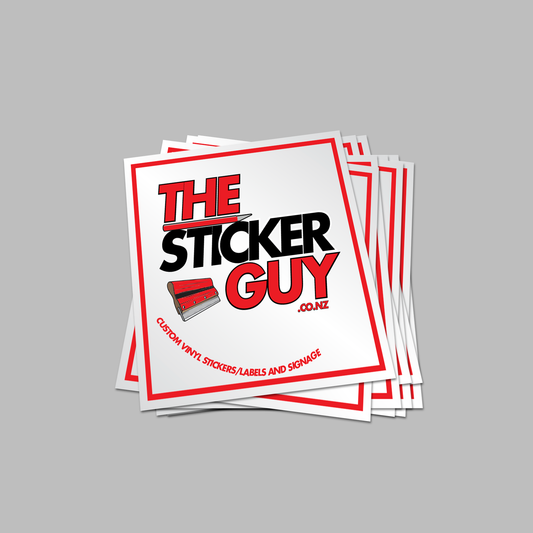Stack of 'The Sticker Guy' branded stickers on a gray background
